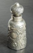 A Victorian silver overlaid glass bottle of cannister form having embossed floral stripe