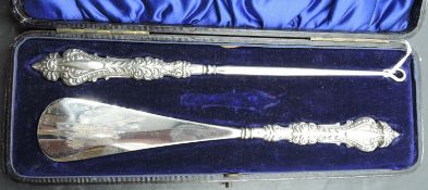 An Edwardian cased silver mounted button hook and shoe horn, marks for Birmingham 1904, maker Adie &