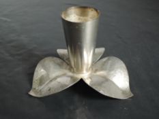 A WMF Silver plated candlestick, of foliate form with elongated trumpet socket and three planished