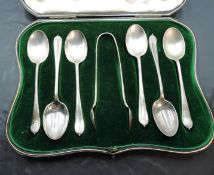 A cased set of six silver teaspoons and sugar tongs, marks for Sheffield 1910, maker Mappin &