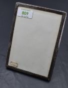 A 1920's silver mounted photograph frame, of plain rectangular form, marks for Birmingham 1922,