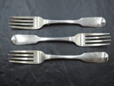 A group of three Georgian silver table forks, fiddle pattern with pip reverse, engraved initials,