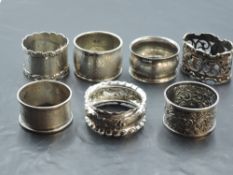A group of seven silver napkin rings, various designs, dates and makers, gross weight 123grams