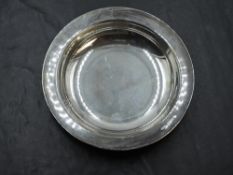 A small cased silver alms dish, of plain form with marks for Birmingham 1938, maker John