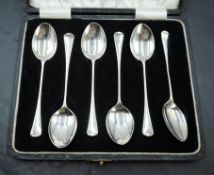 A cased set of six HM silver coffee spoons of plain form, a cased set of six HM silver handled