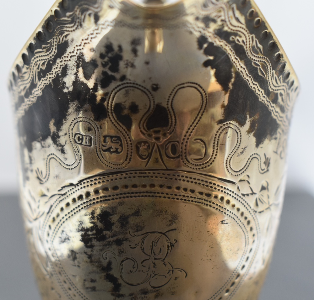 A Georgian silver cream jug of helmet form having loop handle, engraved foliate decoration, pedestal - Image 2 of 2
