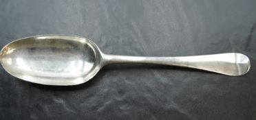An 18th century silver Hanovarian pattern spoon, with oval bowl, the terminal engraved with initials