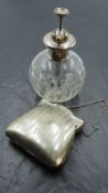 A silver mounted cut glass perfume atomizer, with brass pump and nozzle over the engine turned