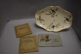 A fine ceramic dish having decorated bird design stamped Copeland to reverse with cigarette albums