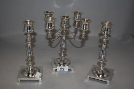 A fine set of Edwardian candle sticks and candelabra silver plated