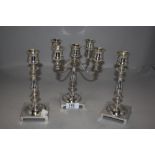 A fine set of Edwardian candle sticks and candelabra silver plated