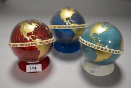 Three world globe style penny savings banks for Nat West, Warrington and district and TSB