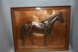 A vintage hand worked copper plaque picture of a race horse bearing signature in oak frame