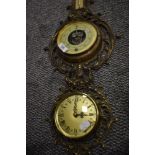 A mid century clock and barometer set having ormolu brass case