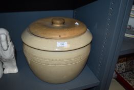 An antique stone ware grain or food container having turned beech wood lid