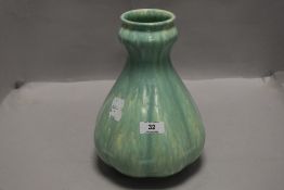 An antique Royal Lancastrian pottery vase, of lobed baluster form with green glaze, no 2335