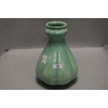 An antique Royal Lancastrian pottery vase, of lobed baluster form with green glaze, no 2335