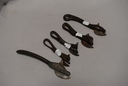 Five antique farm house style can or bottle openers having bulls head design