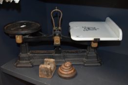 A set of antique kitchen balance scales by Avery having ceramic tray with weight set