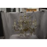 A vintage six branch candelabra having cut glass frame with lustre droplets