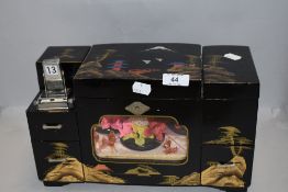 A Chinese style mid century jewellery case with musical mechanism and dancer