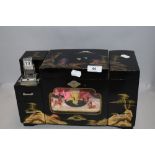 A Chinese style mid century jewellery case with musical mechanism and dancer