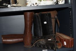 A selection of 20th century leather gaitors and ammunition belt