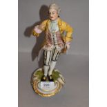 A 20th century porcelain figure of a Georgian man bearing a similar Meissen mark to base