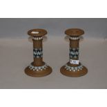 A pair of silicon ware candlesticks circa 1880, having blue and white detailing to beige ground,