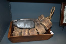 A wooden fruit or similar basket with a set of vintage cork fishing floats
