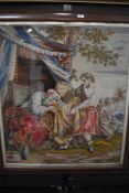 A large vintage framed pictorial needlepoint depicting religious scene.