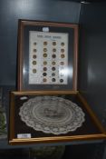 A framed shop style display of Real Horn Domes with a lace work doily