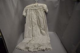 An Edwardian christening gown having lace work details