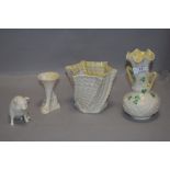 Four pieces of Irish Belleek pottery including pig figure and posy vase