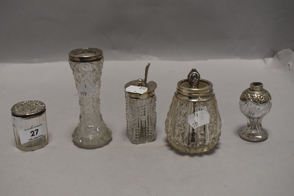 A cruet or similar set of cut glass containers with Hm silver lids