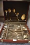A cased set of mid century styled brass cutlery