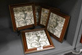 Five Victorian ceramic tiles having a French style design all framed