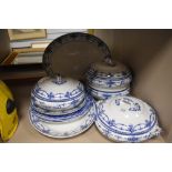 A selection of blue and white ware tureens and charger plates