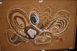 A large abstract mid century collage of naturalistic design on hessian fabric