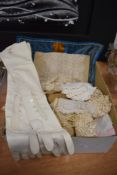 A selection of Victorian lace work and a pair of white leather gloves