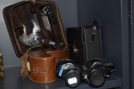 A pair of Ventora 7x14x35 binoculars and two brush sets