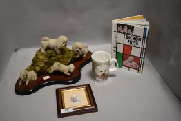 A selection of Bichon Frise collectables including figure base