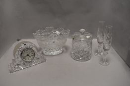 A selection of clear cut crystal glass wares including a Waterford mantle clock