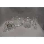A selection of clear cut crystal glass wares including a Waterford mantle clock