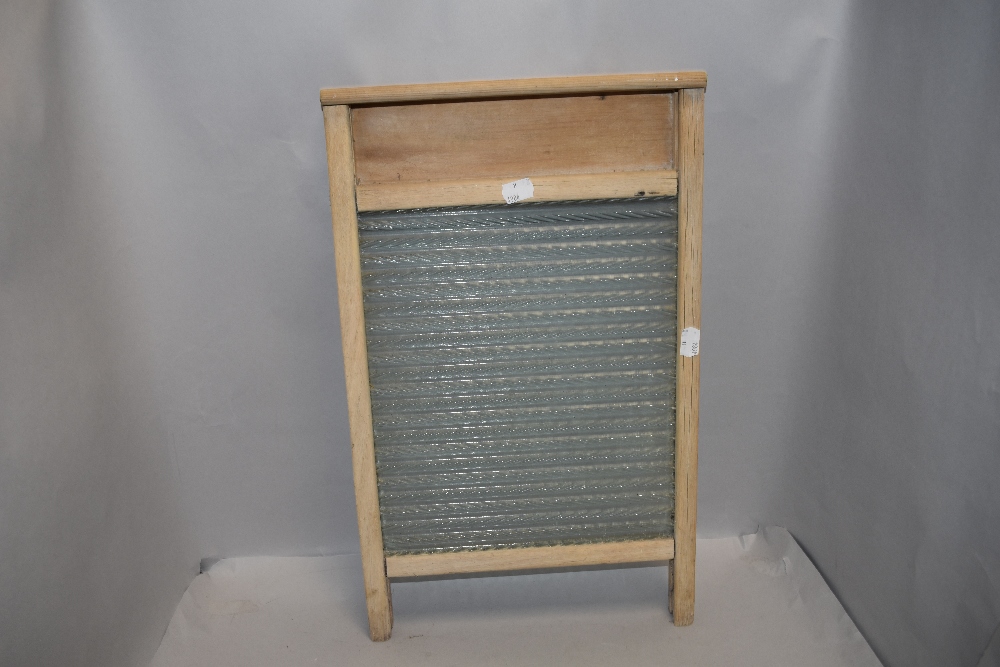 A vintage wooden framed and glass washboard