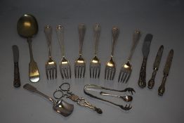 A selection of cutlery and flat wares inclduing some HM silver handle knives
