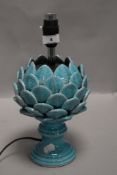 A ceramic table or side lamp in the form of an artichoke having azure blue glaze