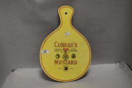 An advertising cheese board for Colman's mustard