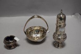 A trio of early 20th century plated ware including chase work sugar sifter, mustard pot with blue