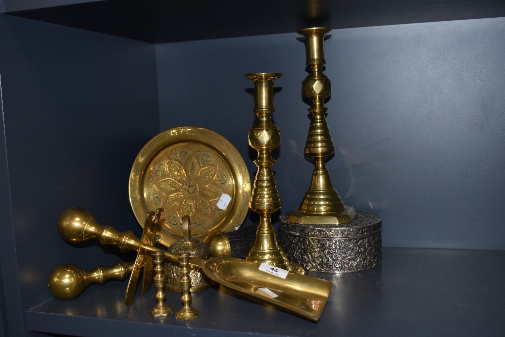 A selection of brass wares including companion set and candle sticks